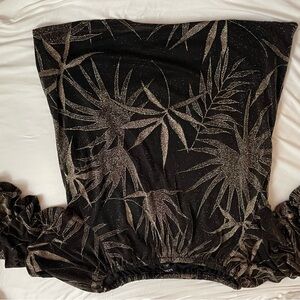 Black and Gold. Body lined with sheer sleeves